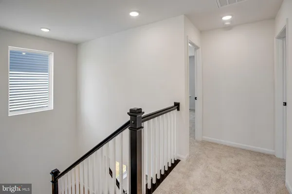 a view of a hallway with stairs