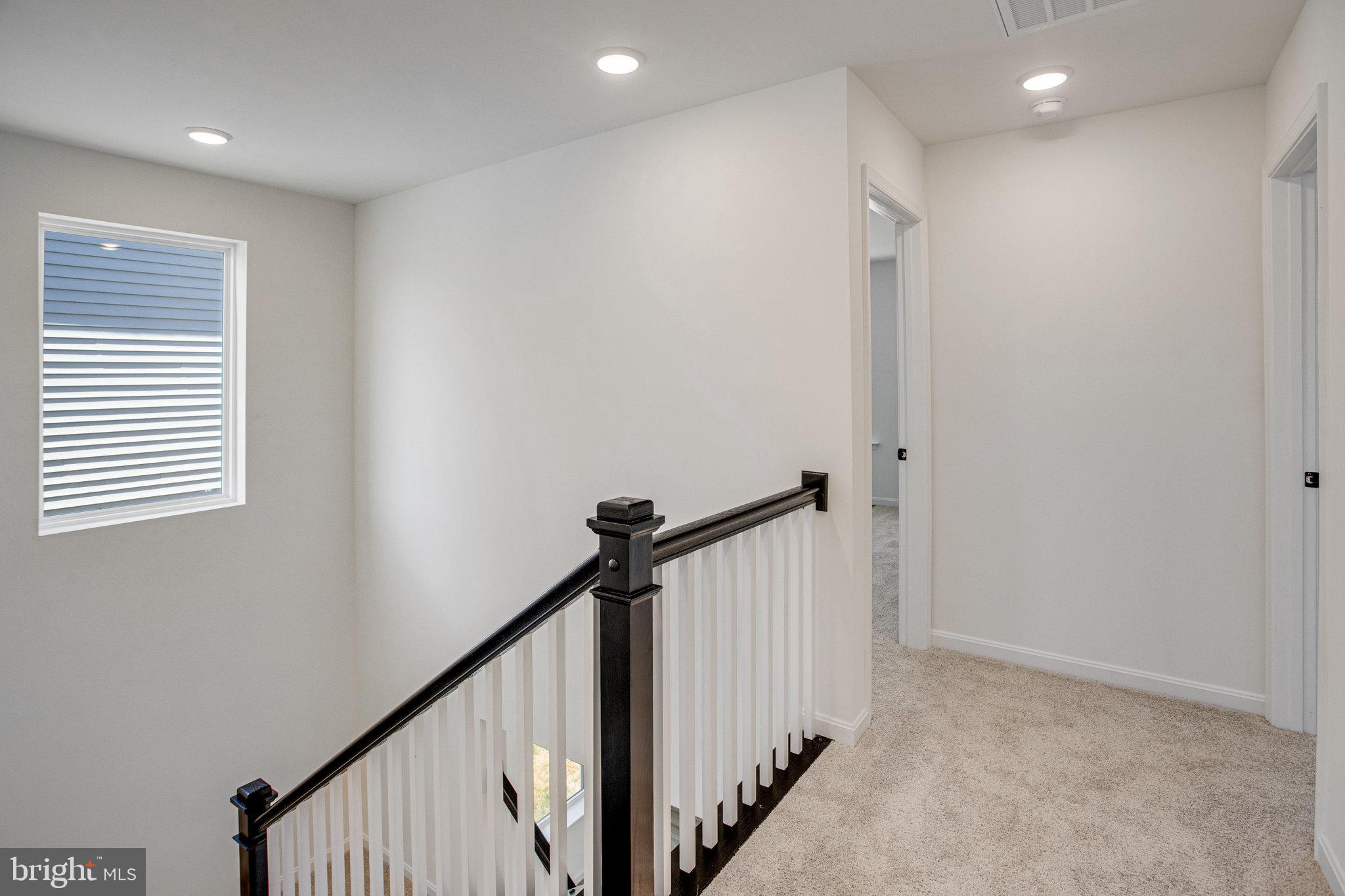 608 Clover Lane Orange, VA 22960 - Photo 5 of 38 a view of a hallway with stairs