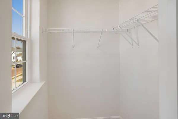 a view of a room with racks on the wall