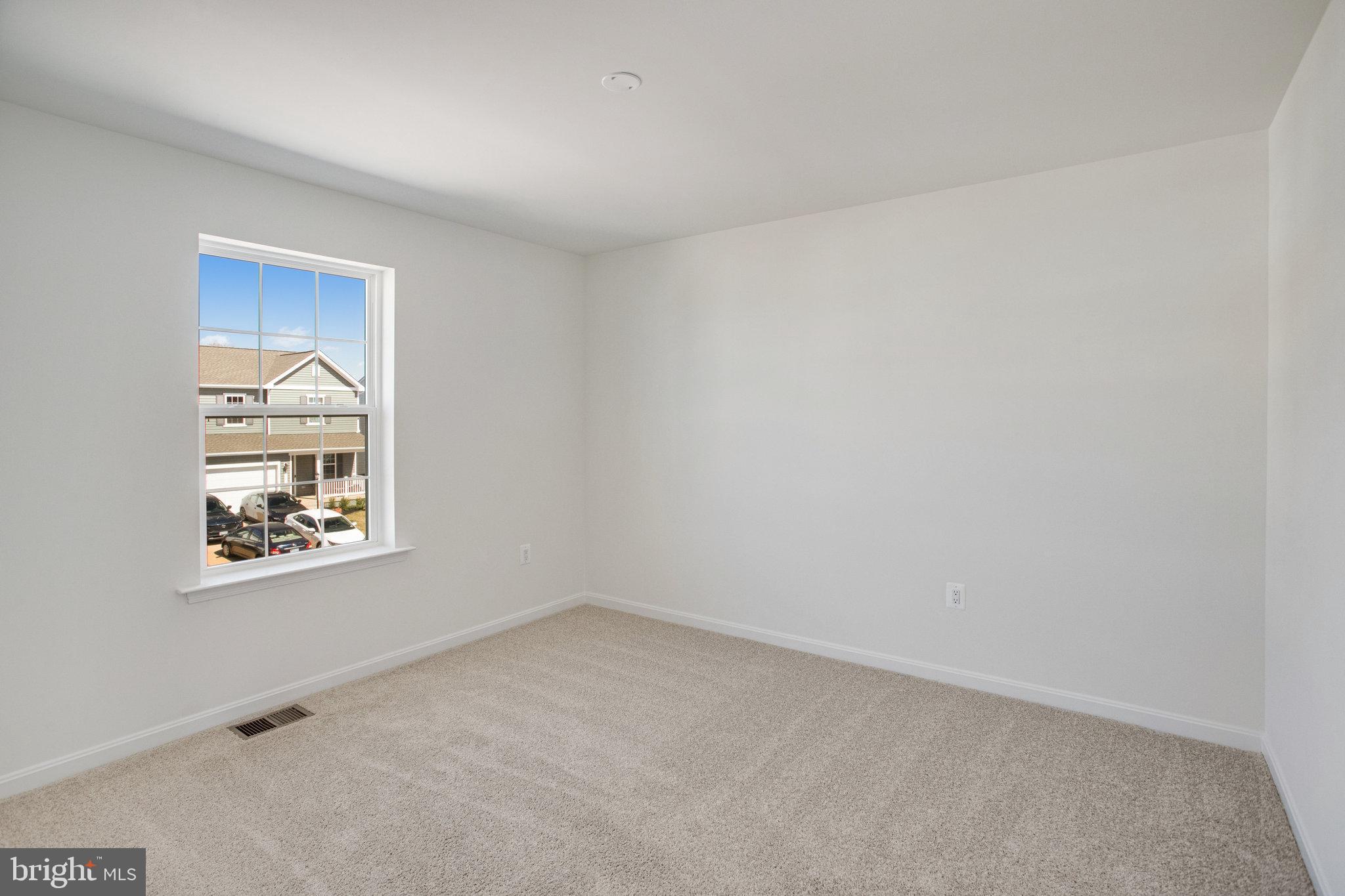 608 Clover Lane Orange, VA 22960 - Photo 9 of 38 an empty room with a window