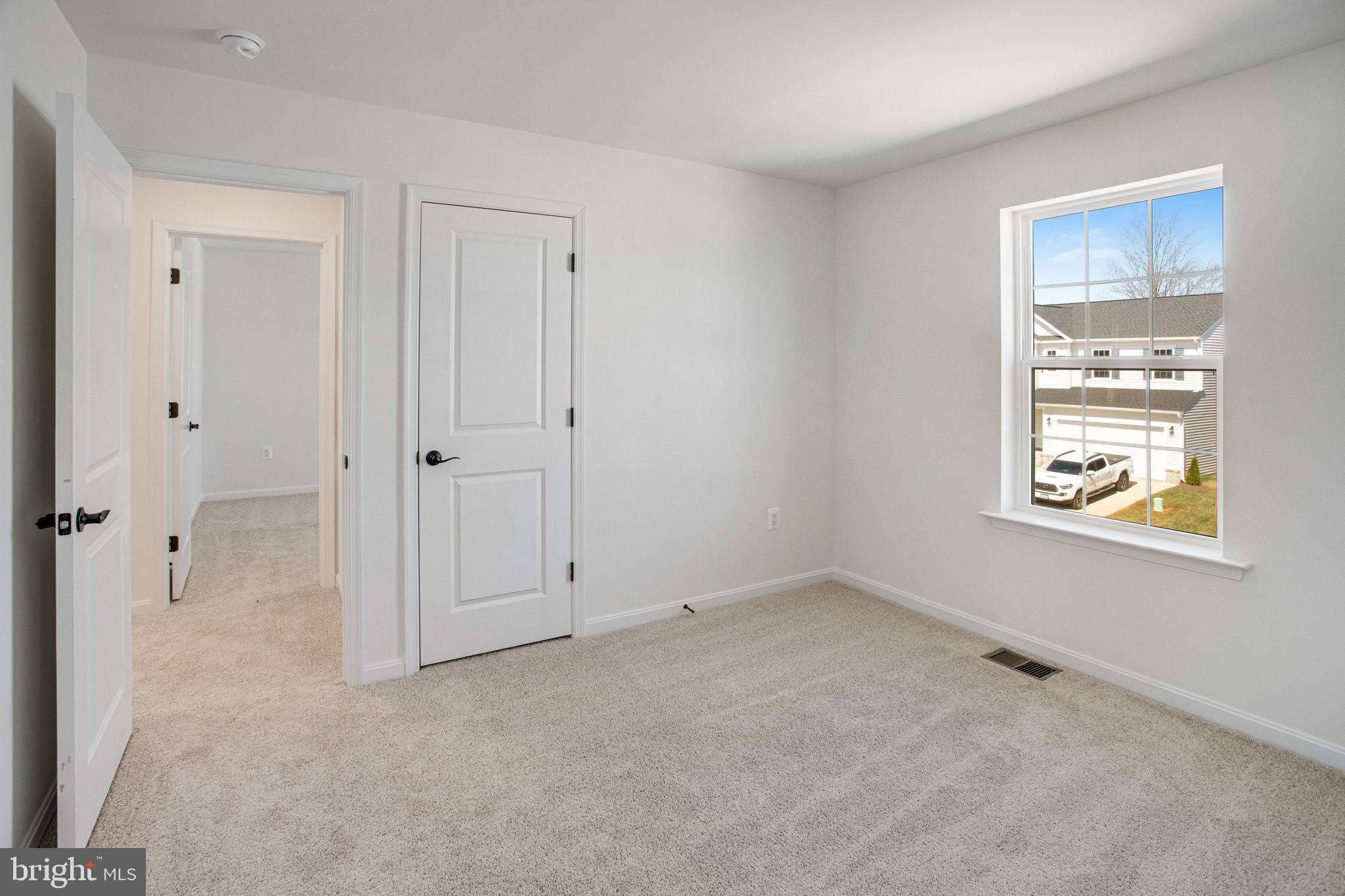 608 Clover Lane Orange, VA 22960 - Photo 10 of 38 a view of an empty room with windows and closet
