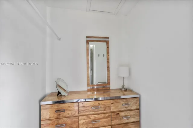 a view of bathroom with sink and mirror