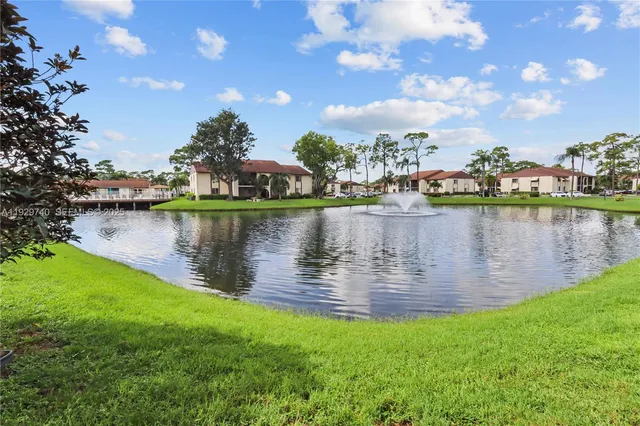 a view of a lake with a big yard
