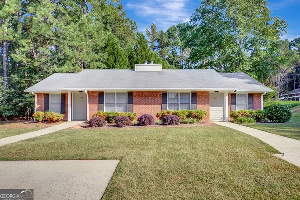 front view of a house with a yard