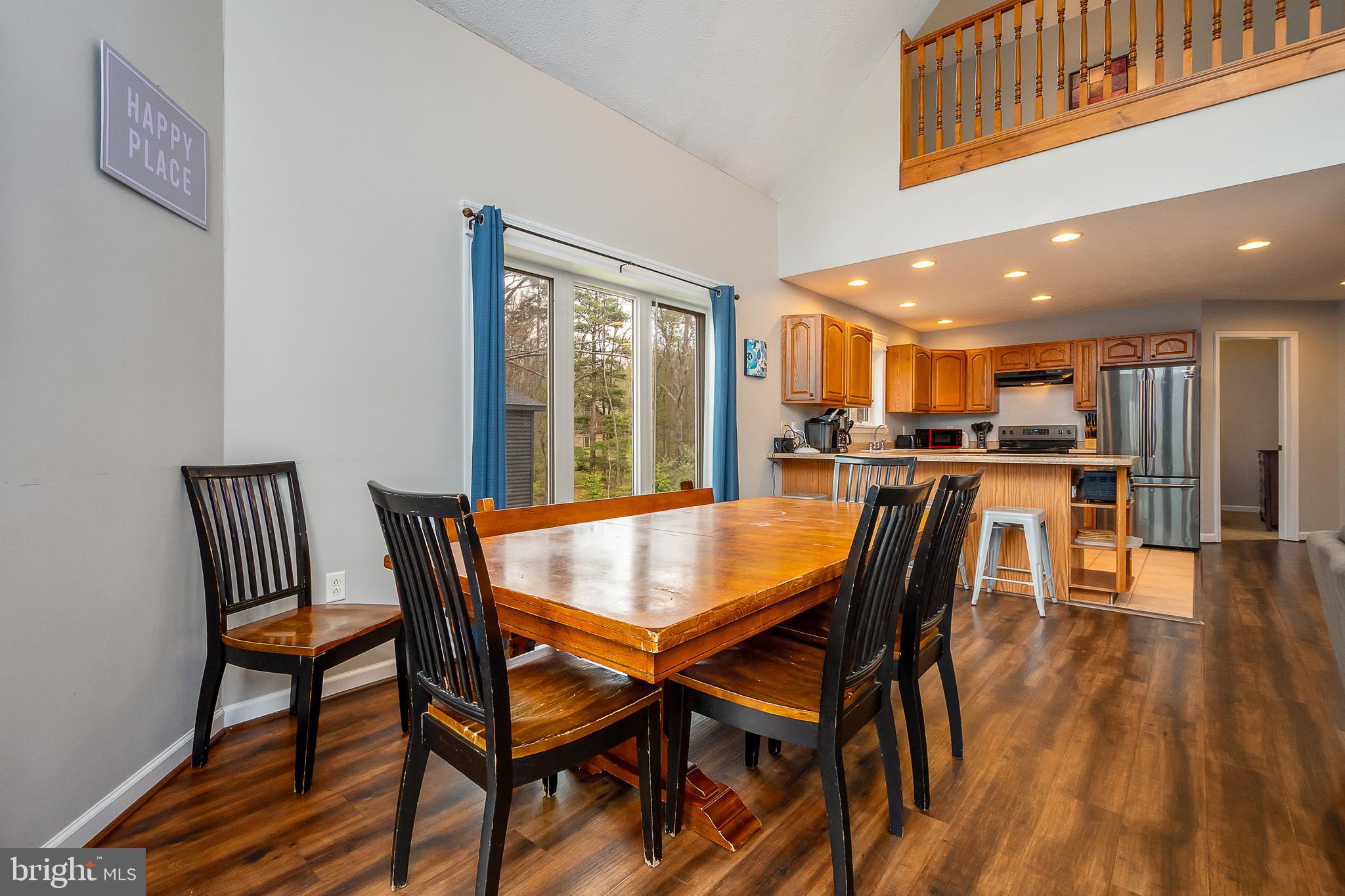638 Glendale Road Oakland, MD 21550 - Photo 17 of 56 a dining room with a wooden table and chairs