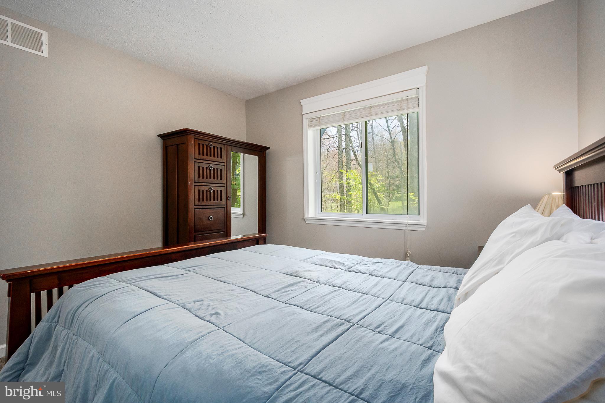 638 Glendale Road Oakland, MD 21550 - Photo 24 of 56 a bedroom with a bed and a window