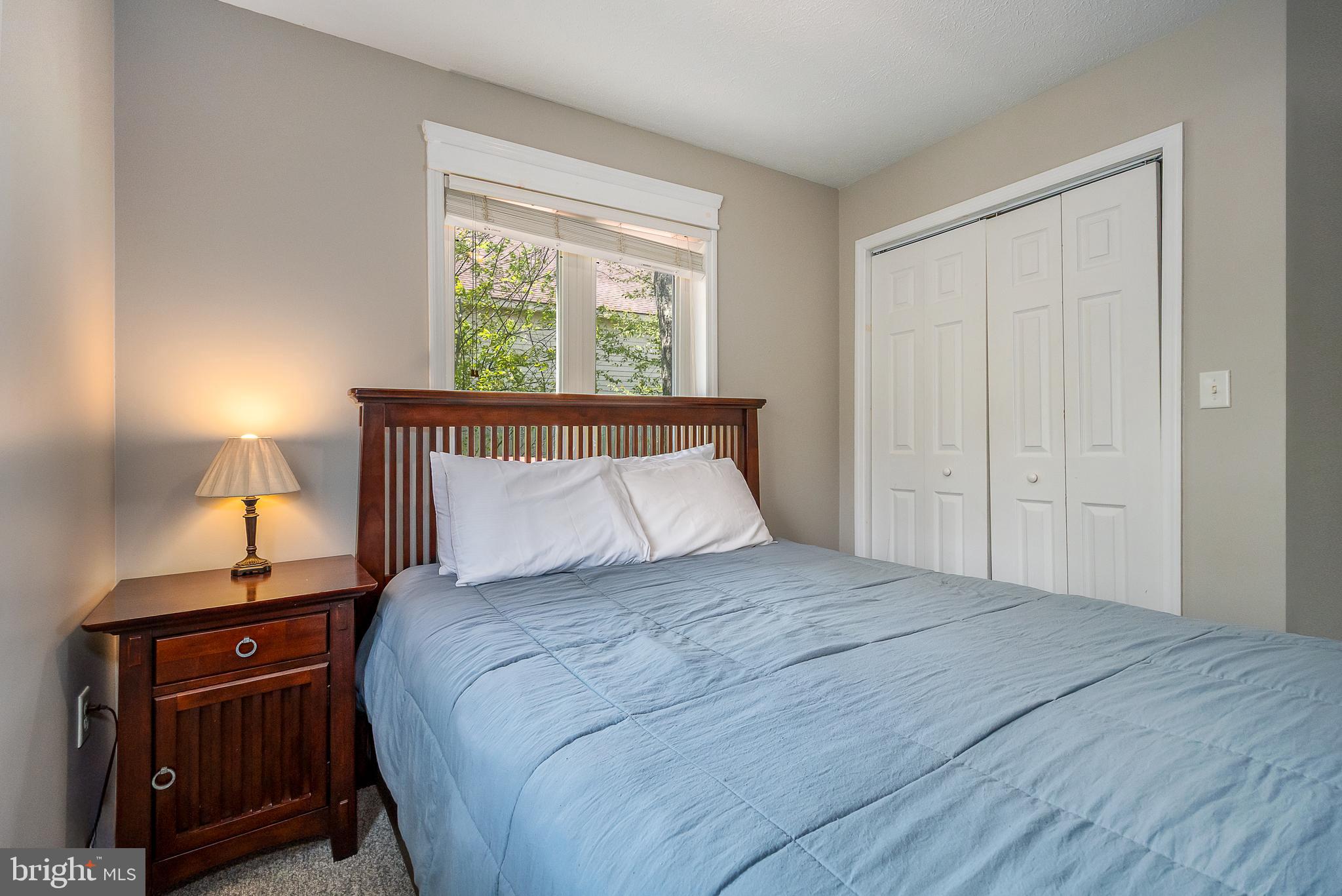 638 Glendale Road Oakland, MD 21550 - Photo 25 of 56 a bedroom with a bed and a night stand