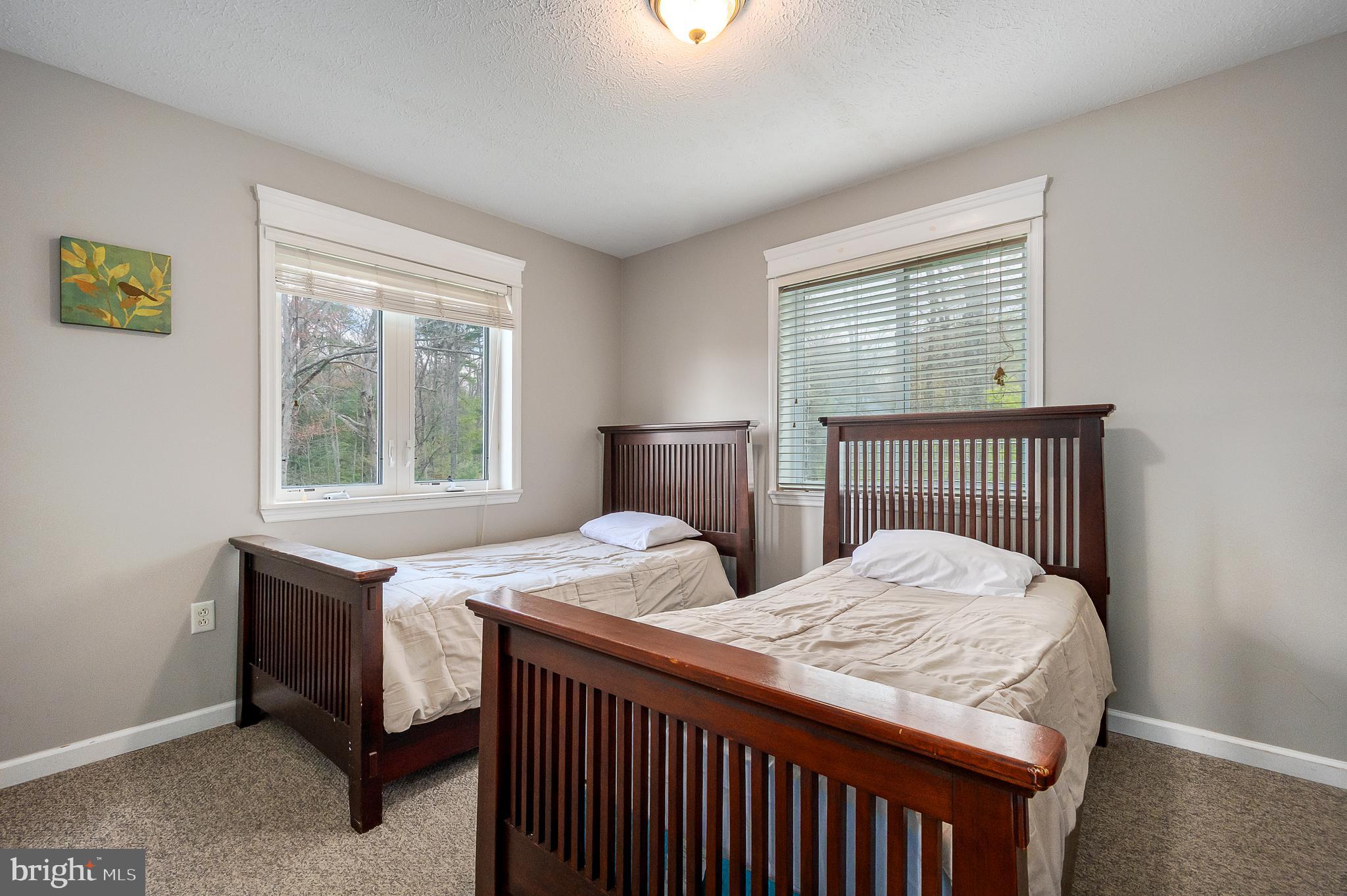 638 Glendale Road Oakland, MD 21550 - Photo 29 of 56 a bedroom with two beds and a window