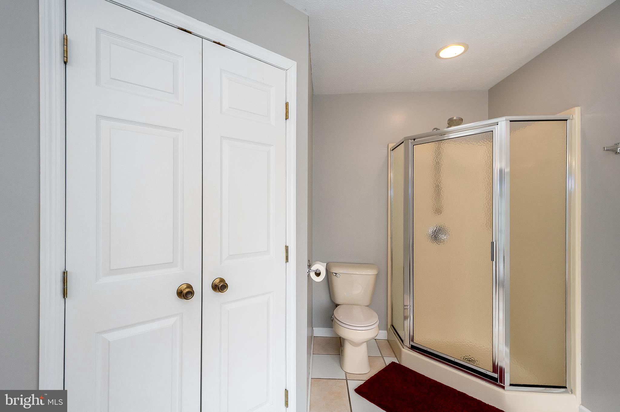 638 Glendale Road Oakland, MD 21550 - Photo 33 of 56 a bathroom with a shower and a toilet