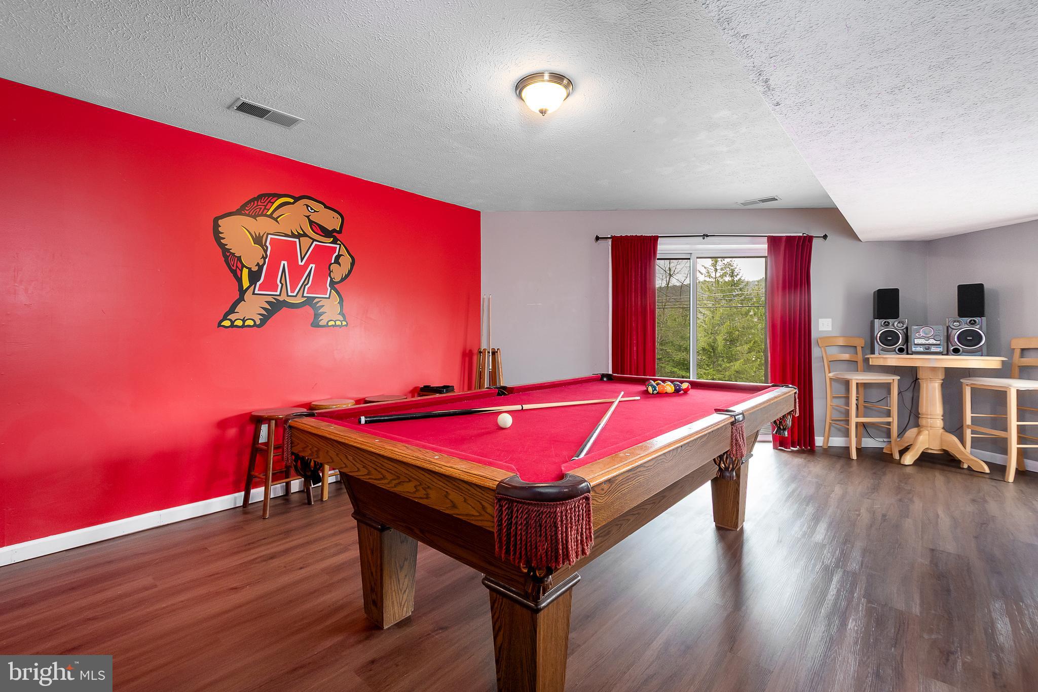638 Glendale Road Oakland, MD 21550 - Photo 44 of 56 a living room with a table and a pool table