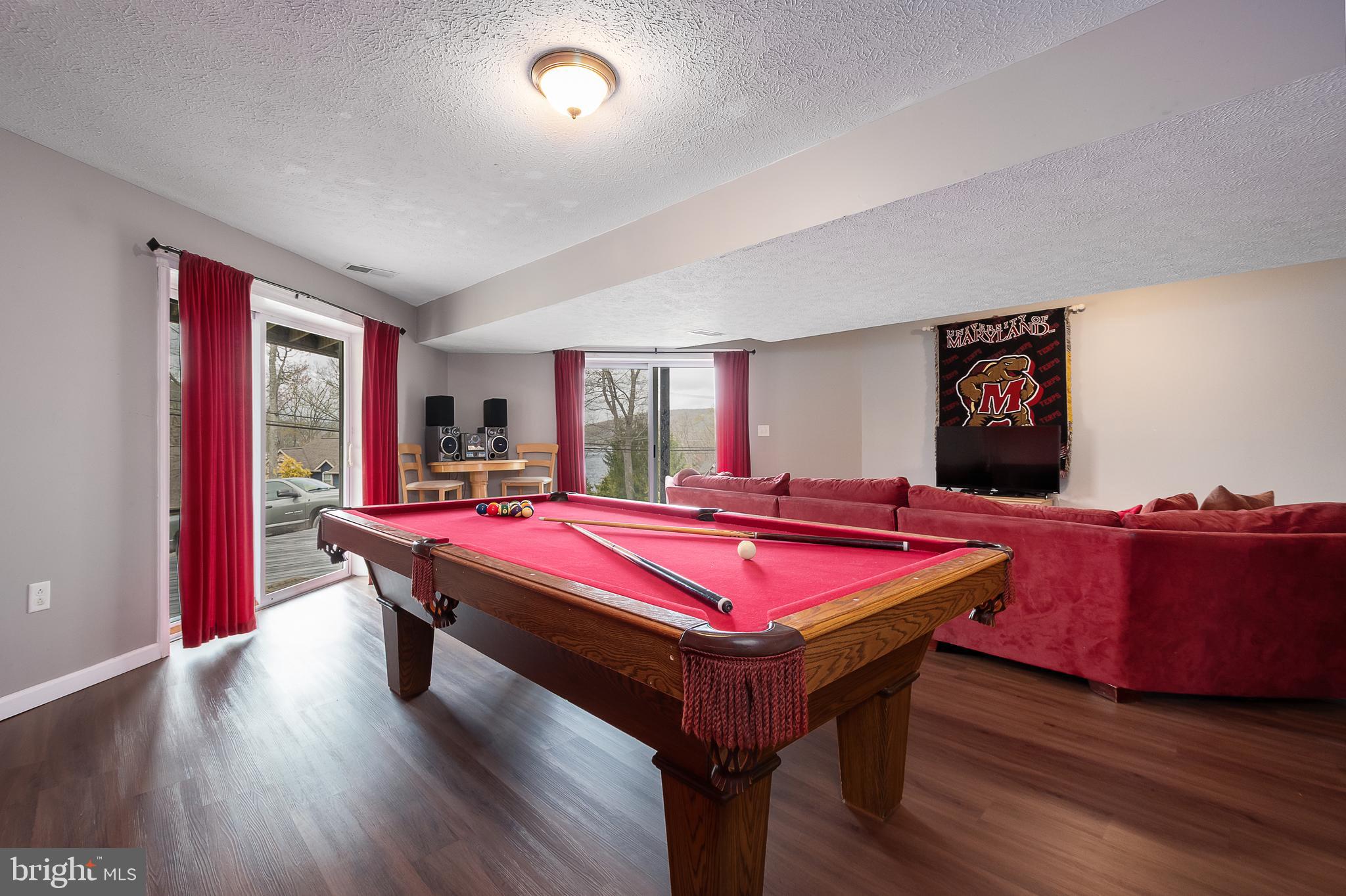 638 Glendale Road Oakland, MD 21550 - Photo 45 of 56 a room with furniture pool table wooden floor and window