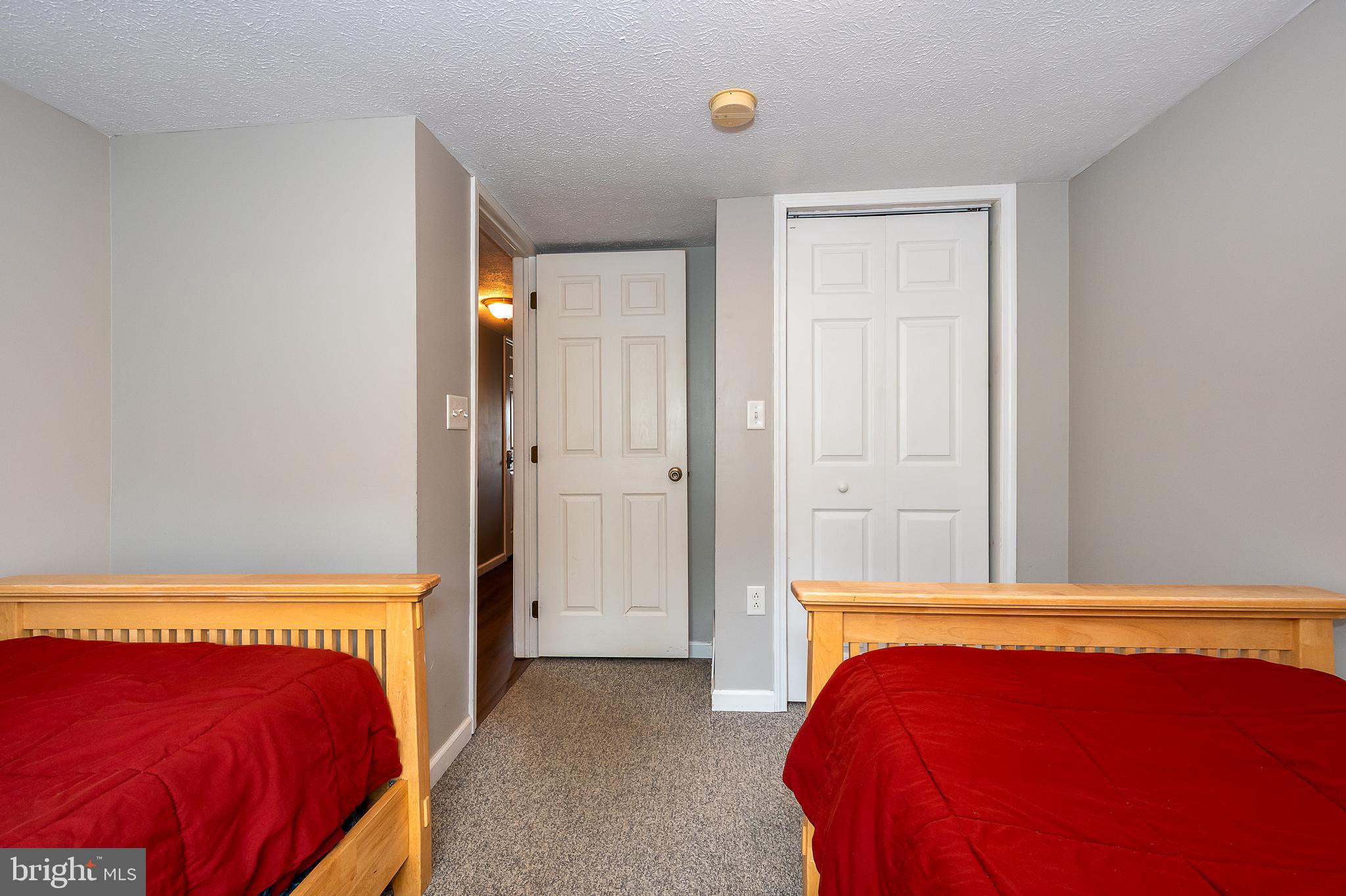 638 Glendale Road Oakland, MD 21550 - Photo 51 of 56 a bedroom with a bed and a closet