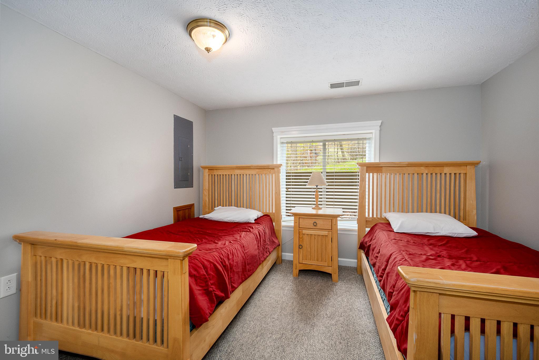 638 Glendale Road Oakland, MD 21550 - Photo 53 of 56 a bedroom with a bed and a window