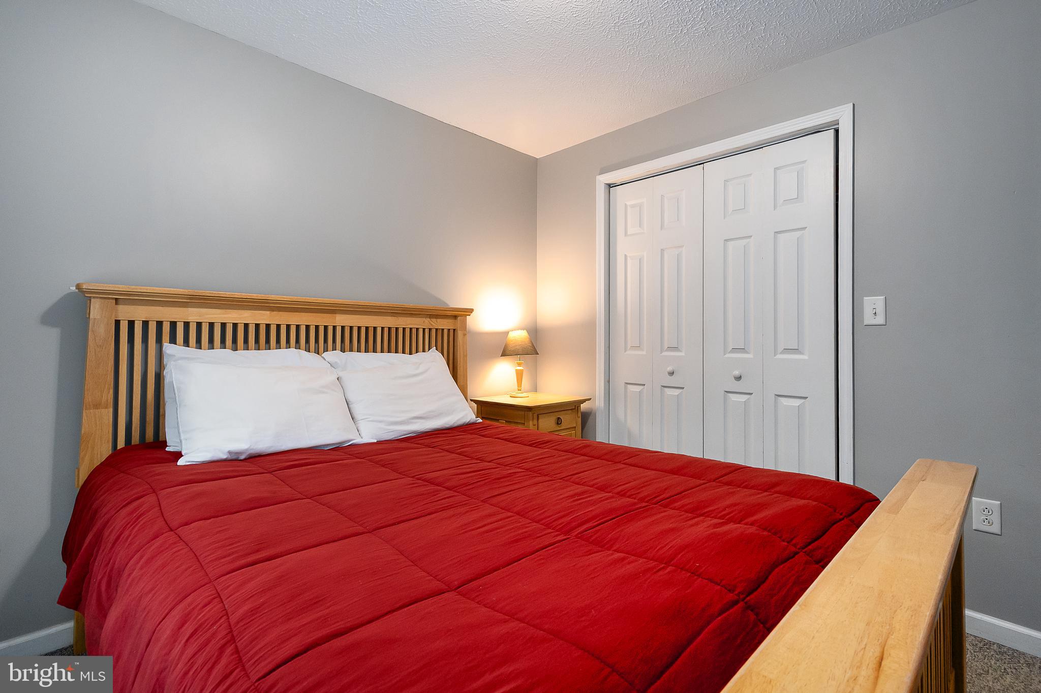 638 Glendale Road Oakland, MD 21550 - Photo 55 of 56 a bedroom with a bed and a night stand