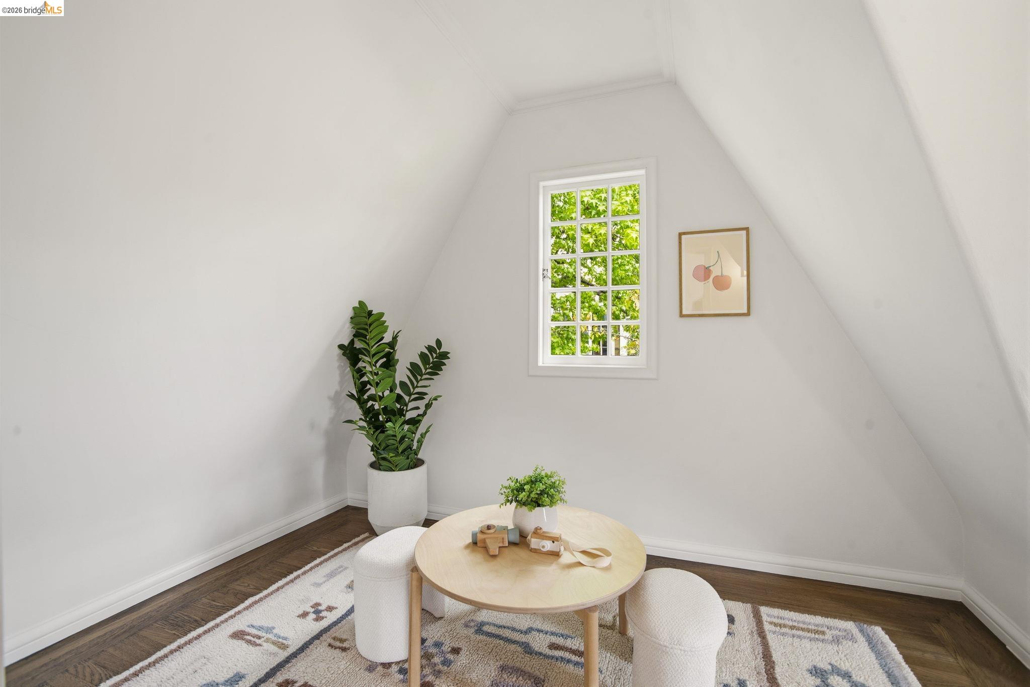 1087 Hubert Road Oakland, CA 94610 - Photo 32 of 67 Room with sloped ceilings and dark wood-finish flooring