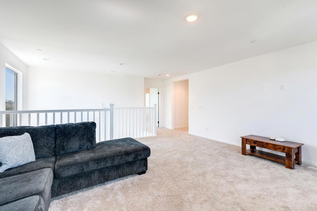 30343 Singer Lane Menifee, CA 92584 - Photo 13 of 24 a living room with furniture and a couch