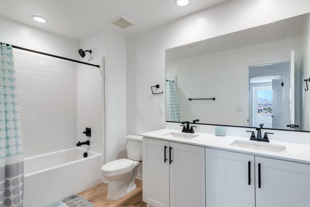 30343 Singer Lane Menifee, CA 92584 - Photo 21 of 24 a bathroom with a sink toilet and shower