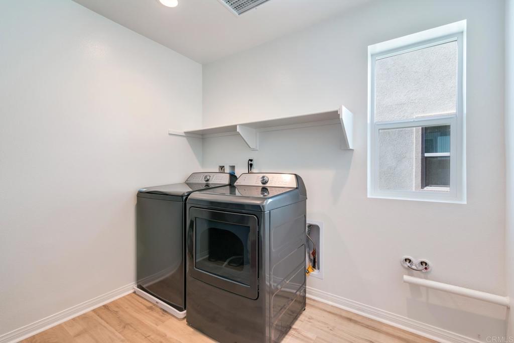 30343 Singer Lane Menifee, CA 92584 - Photo 22 of 24 a utility room with dryer and washer