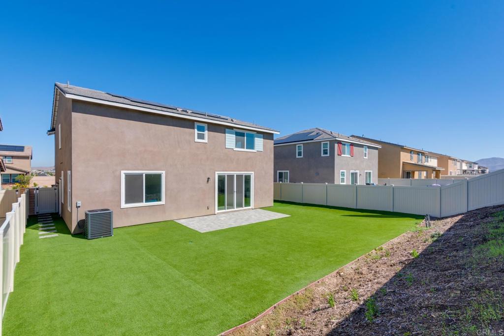 30343 Singer Lane Menifee, CA 92584 - Photo 23 of 24 a house view with a garden space