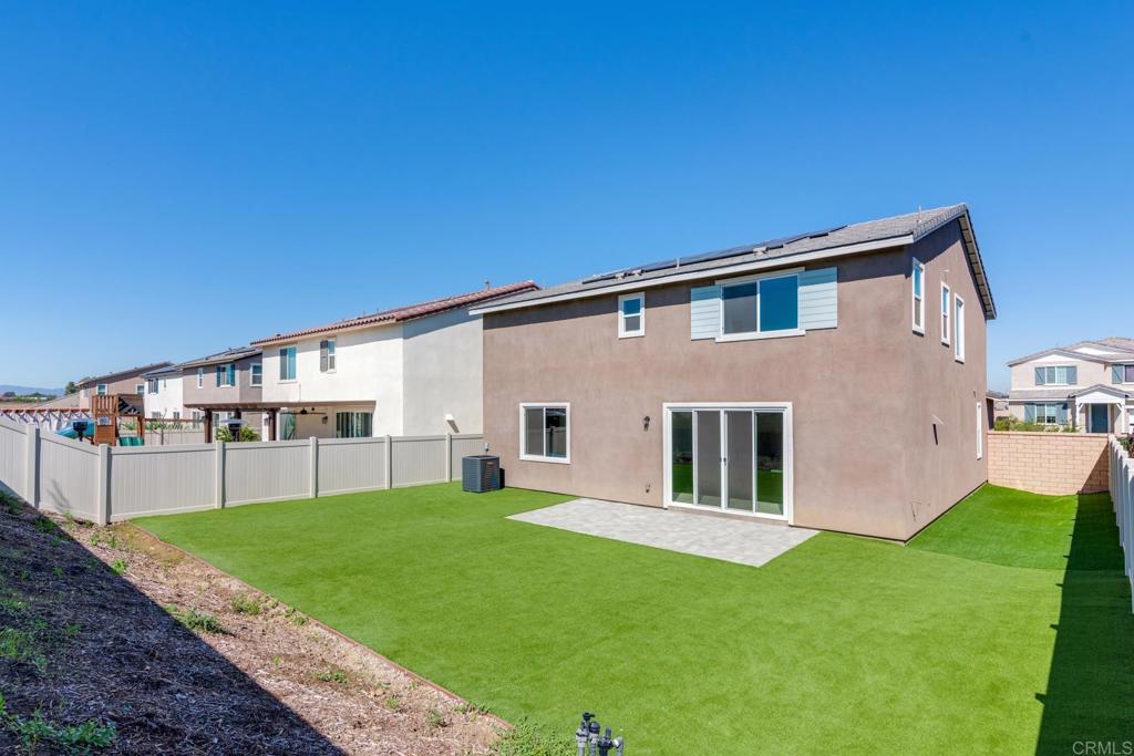30343 Singer Lane Menifee, CA 92584 - Photo 24 of 24 a front view of house with yard and green space