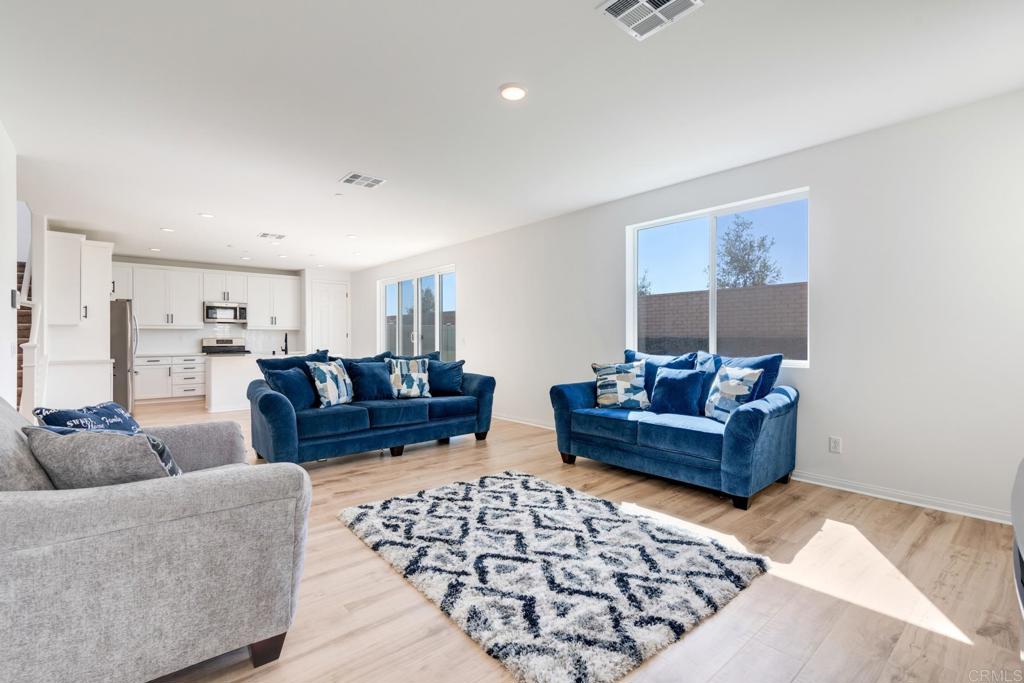 30343 Singer Lane Menifee, CA 92584 - Photo 6 of 24 a living room with furniture and wooden floor