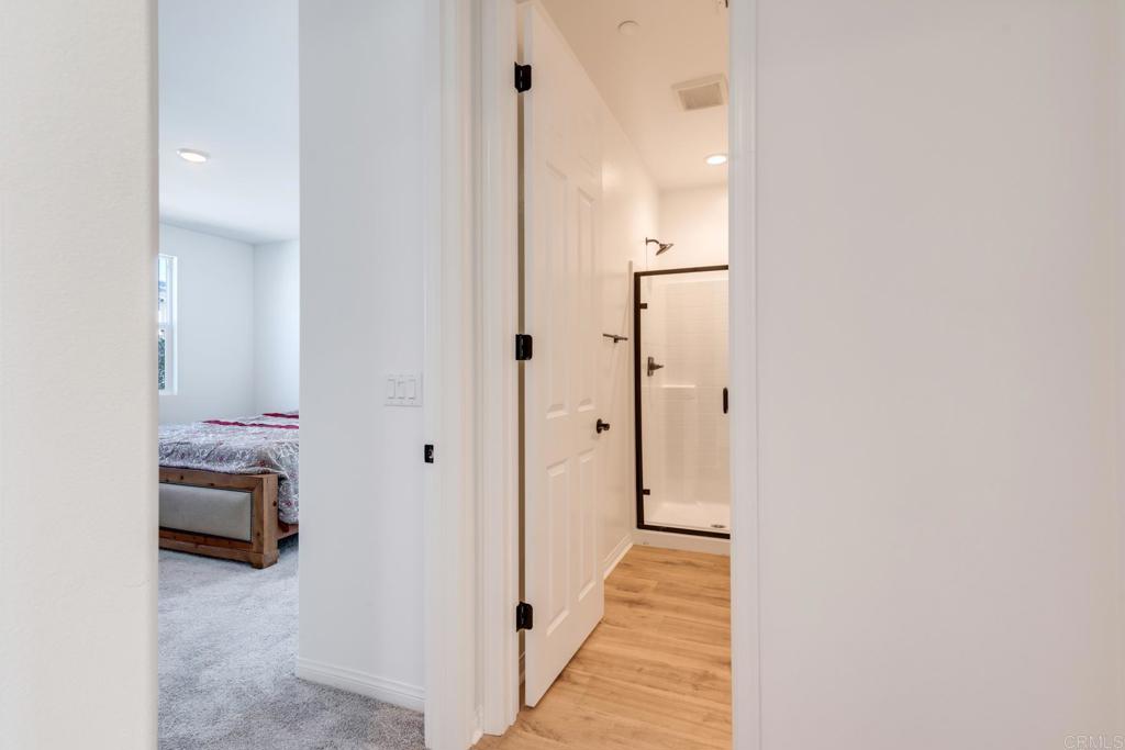 30343 Singer Lane Menifee, CA 92584 - Photo 7 of 24 a view of a hallway with wooden floor