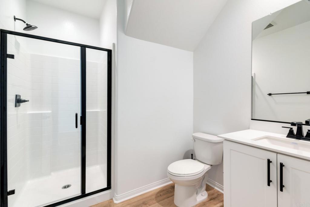 30343 Singer Lane Menifee, CA 92584 - Photo 10 of 24 a bathroom with a sink toilet and shower