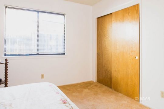204 North Broadway Street Ridgecrest, CA 93555 - Photo 24 of 29 a bedroom with a bed and a window