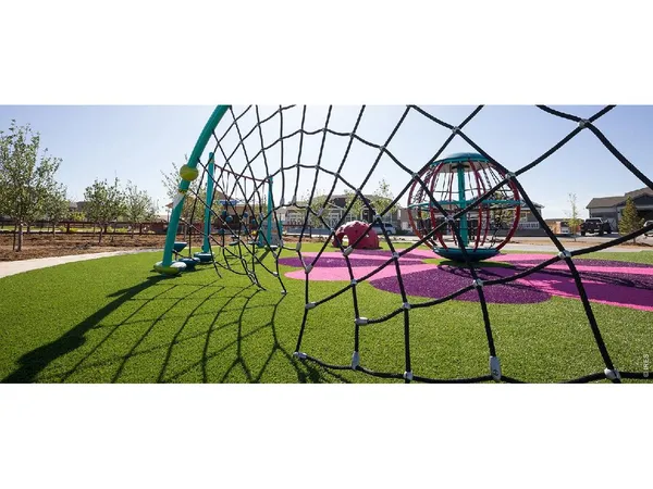 an aerial view of a house with a table and chairs
