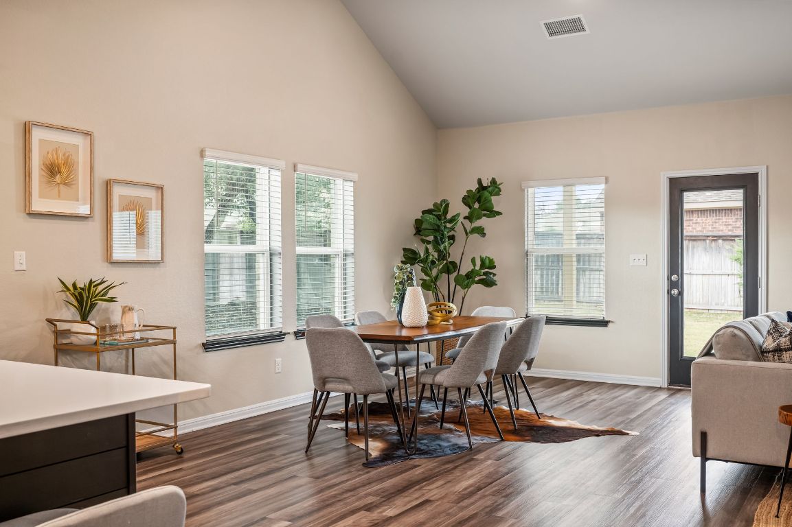 1509 Deering Run Leander, TX 78641 - Photo 15 of 37 a view of a dining room with furniture window and wooden floor