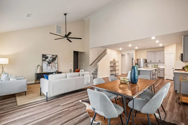 a view of a dining room with furniture window and wooden floor