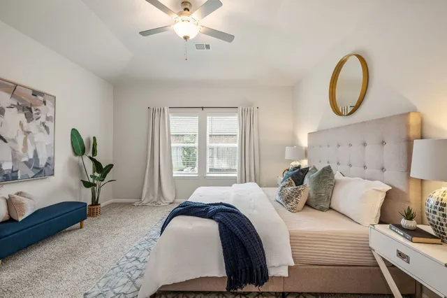 a bed room with a bed and a chandelier