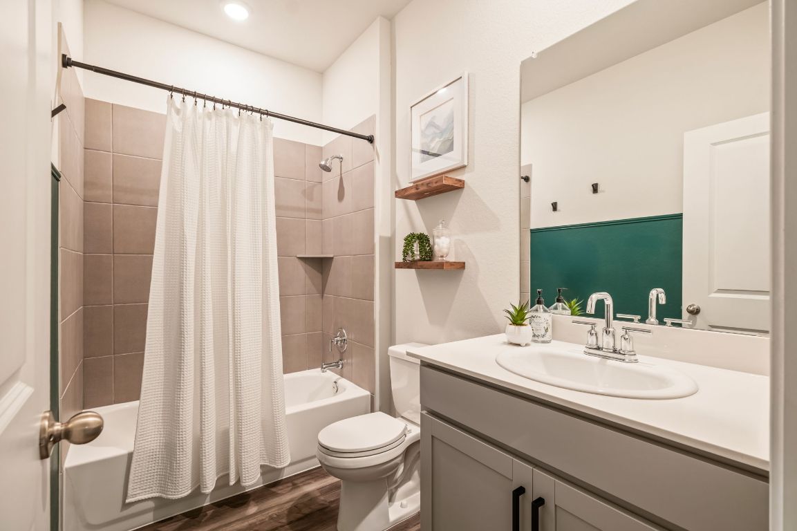 1509 Deering Run Leander, TX 78641 - Photo 26 of 37 a bathroom with a sink toilet and shower