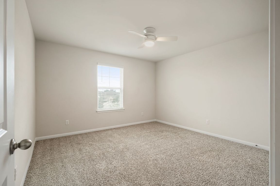 1509 Deering Run Leander, TX 78641 - Photo 31 of 37 wooden floor in an empty room with a window