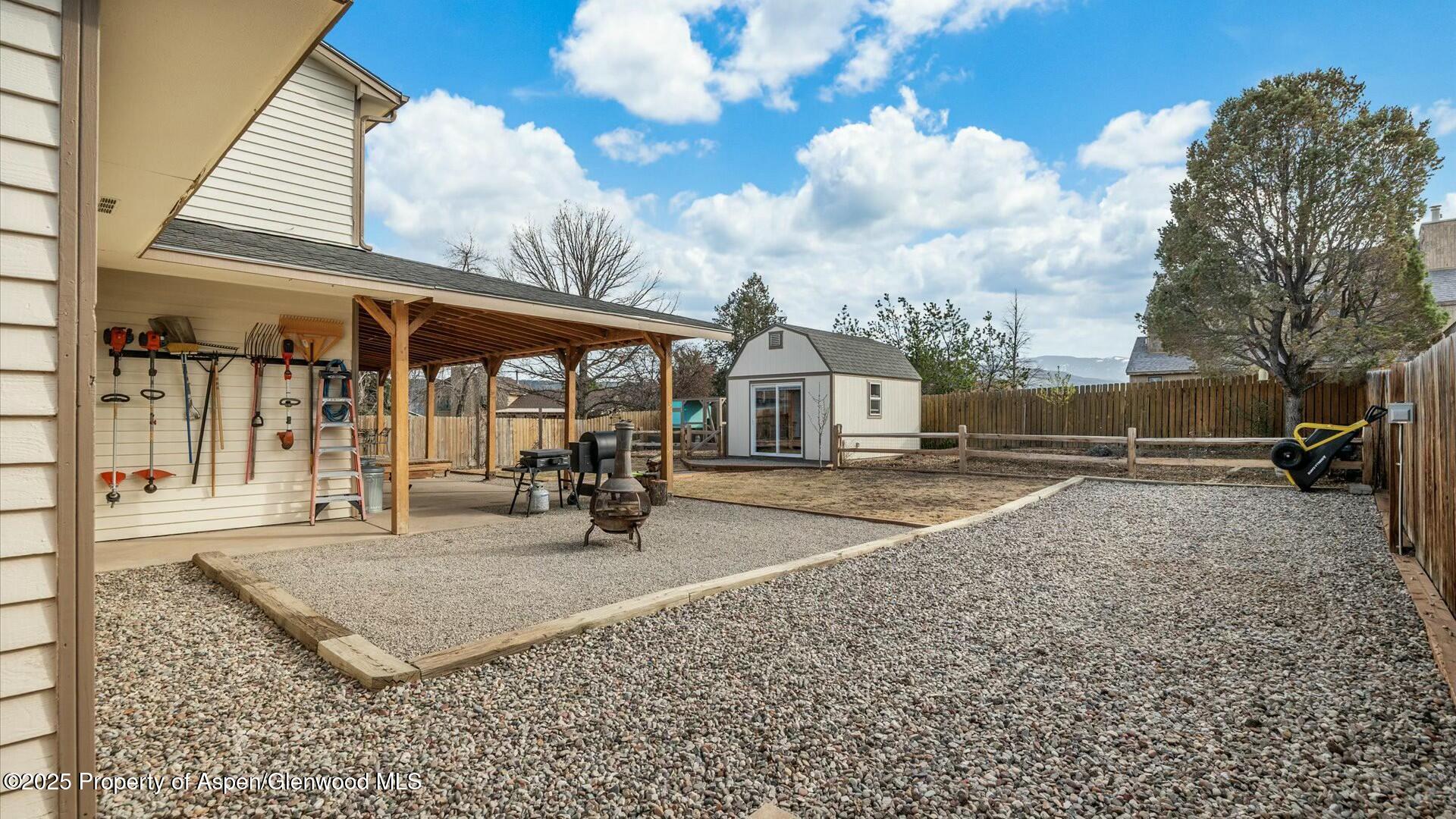 1201 Fir Avenue Rifle, CO 81650 - Photo 23 of 25 a view of a house with backyard porch and sitting area
