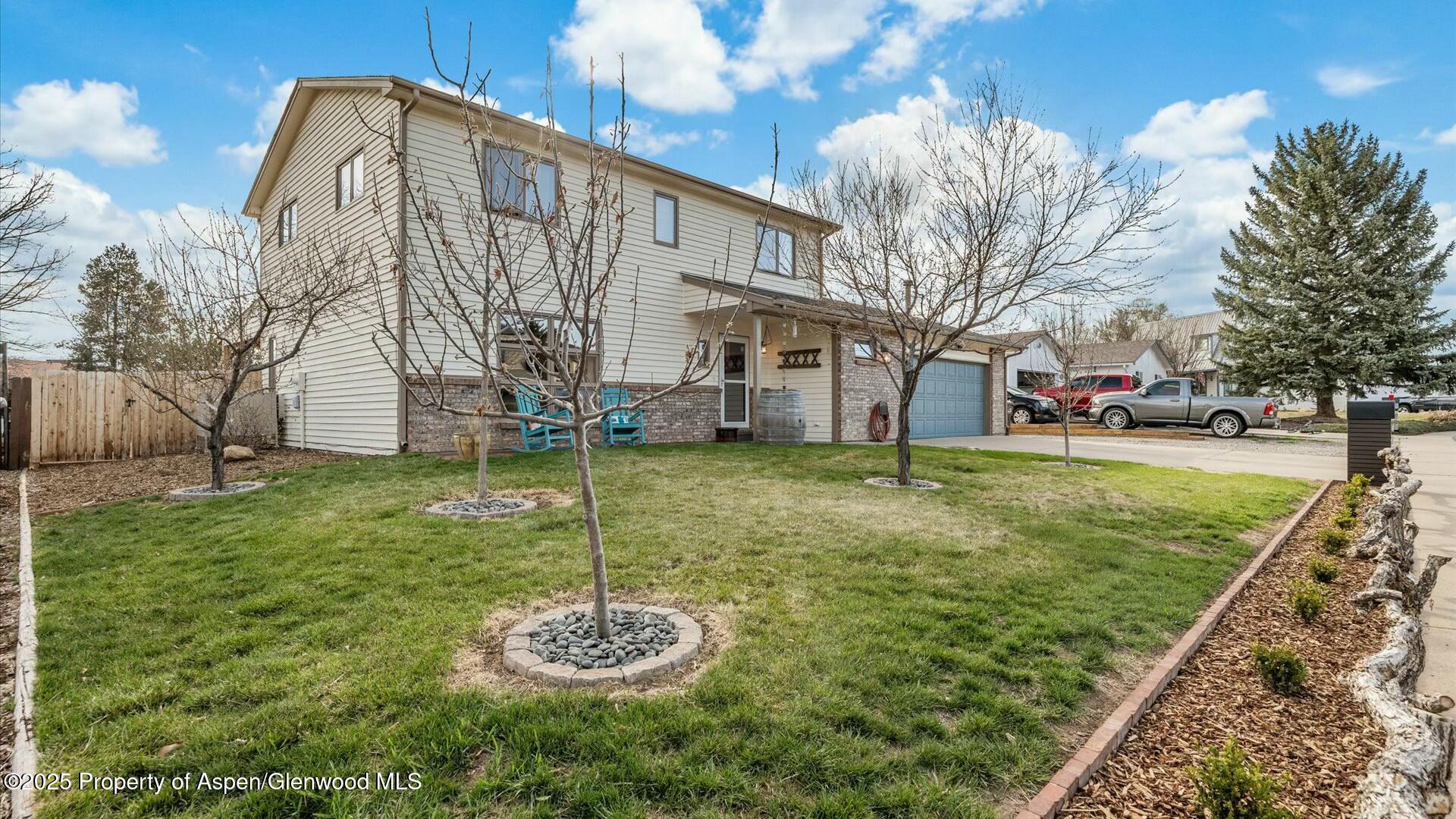 1201 Fir Avenue Rifle, CO 81650 - Photo 3 of 25 a view of a house with a yard