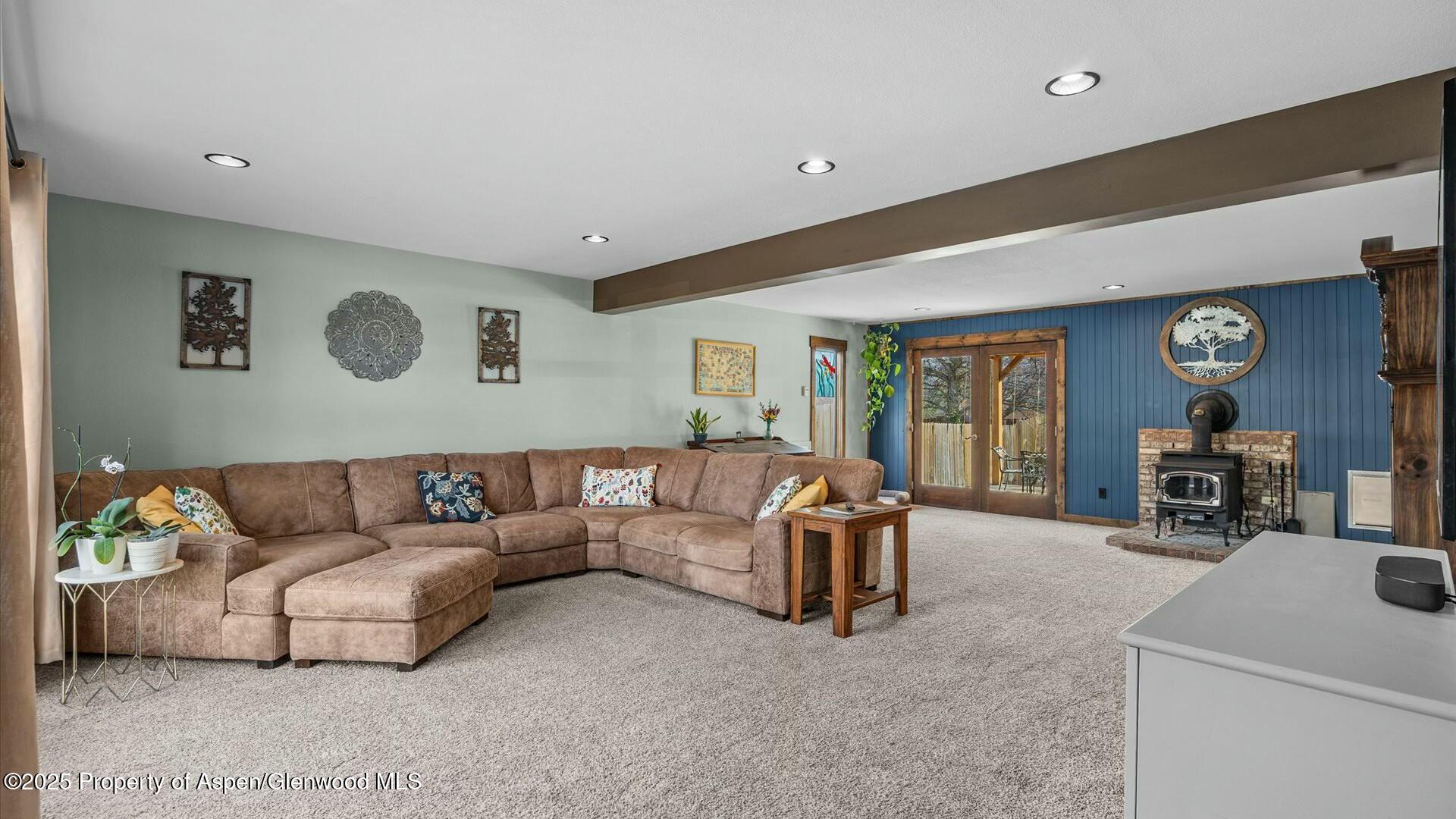 1201 Fir Avenue Rifle, CO 81650 - Photo 7 of 25 a living room with furniture and a flat screen tv