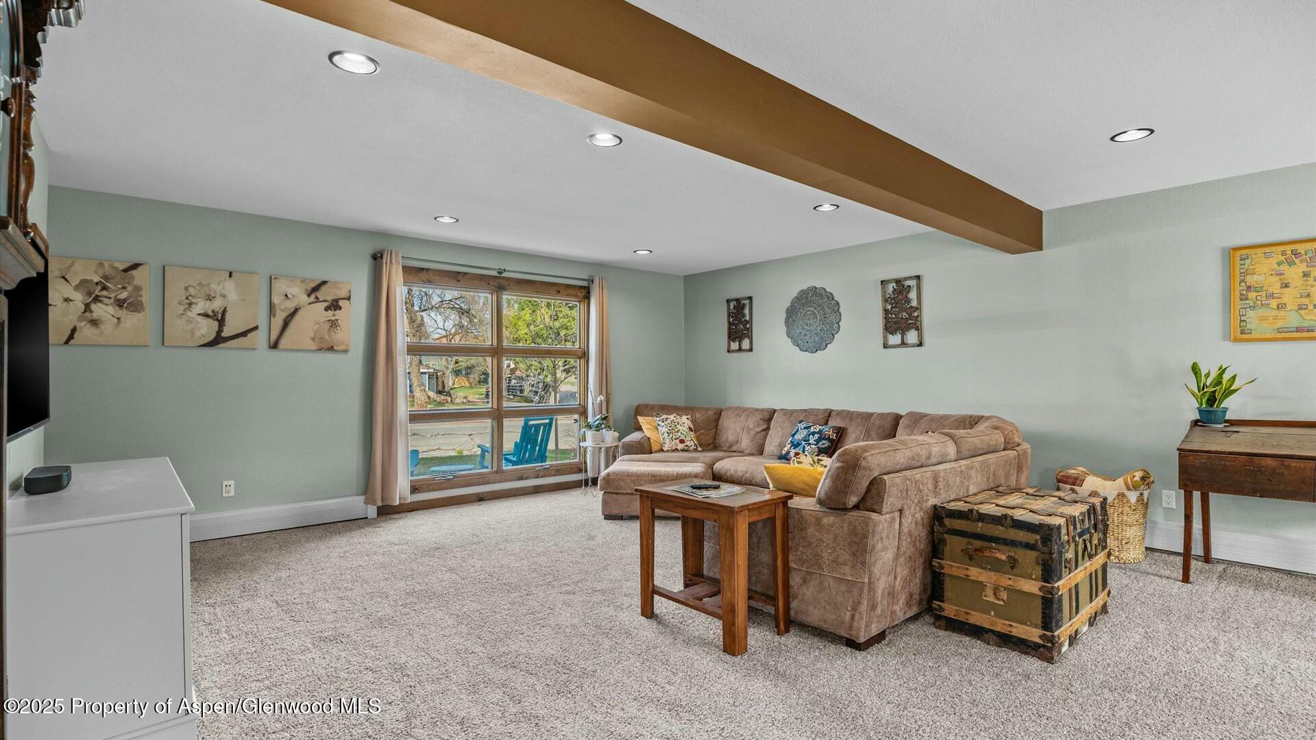 1201 Fir Avenue Rifle, CO 81650 - Photo 8 of 25 a living room with furniture and a window