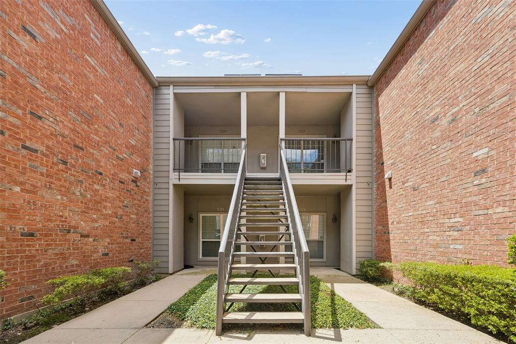 12660 Hillcrest Road, Unit 7205 Dallas, TX 75230 - Photo 2 of 25 Multi-level building with brick and siding exterior