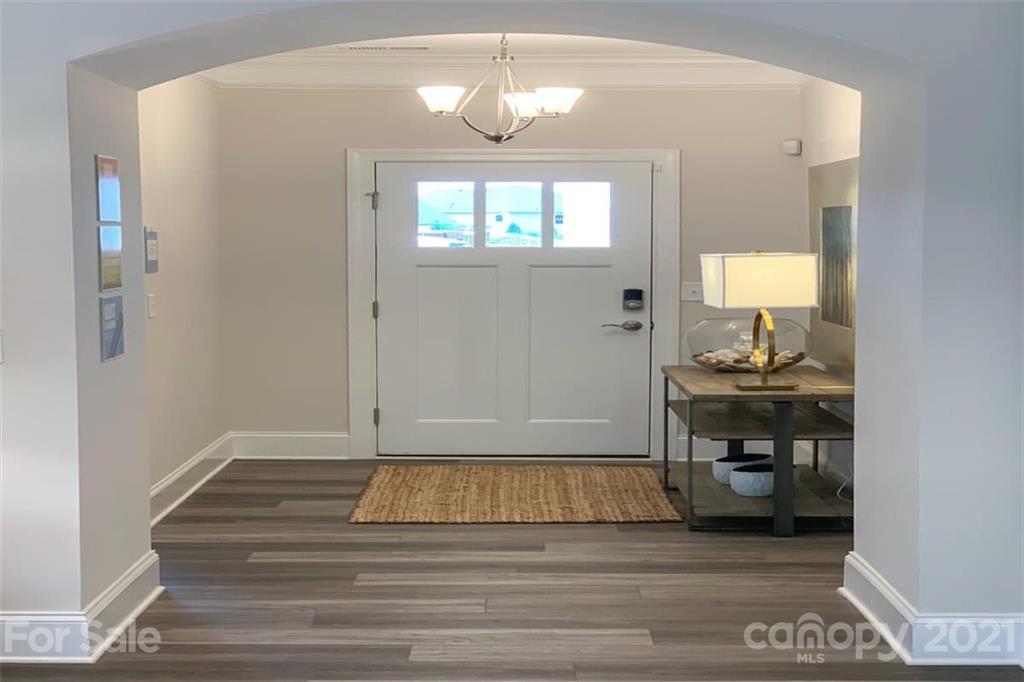 2023 New Style Way, Unit 24 Tega Cay, SC 29708 - Photo 2 of 18 a view of a livingroom with wooden floor and a window