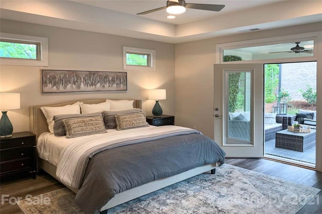 2023 New Style Way, Unit 24 Tega Cay, SC 29708 - Photo 15 of 18 a bedroom with bed and large window