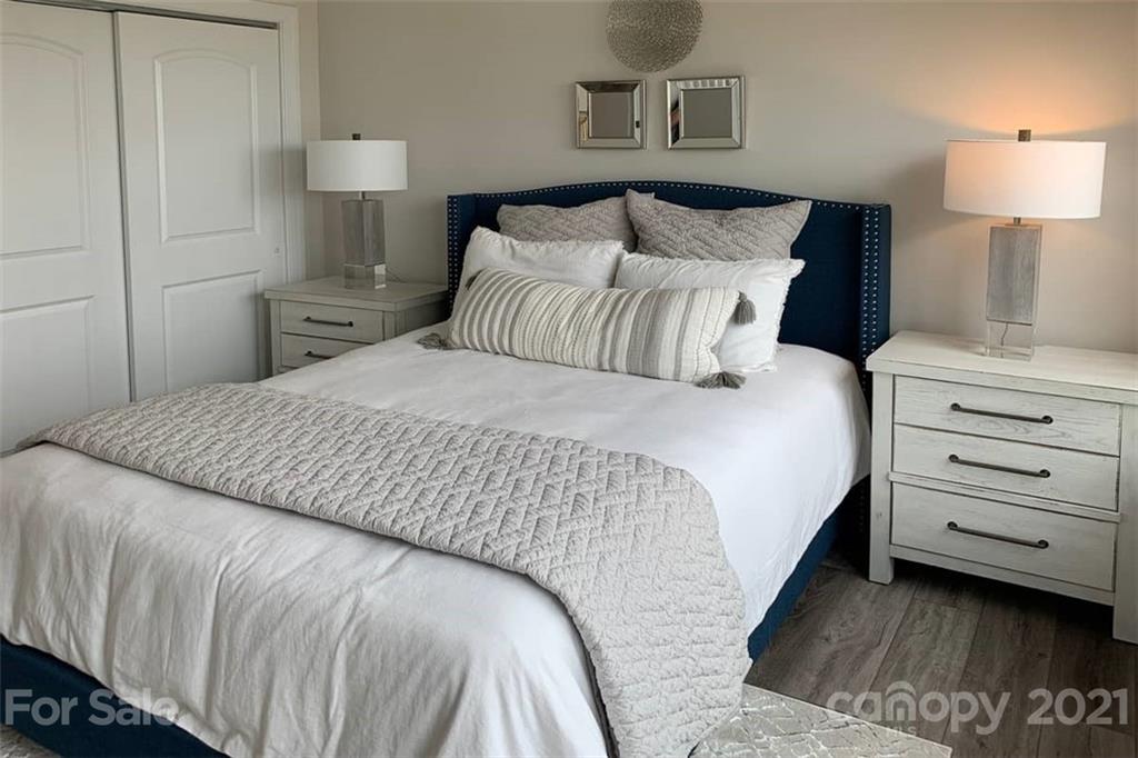 2023 New Style Way, Unit 24 Tega Cay, SC 29708 - Photo 5 of 18 a bedroom with a bed and a night stand