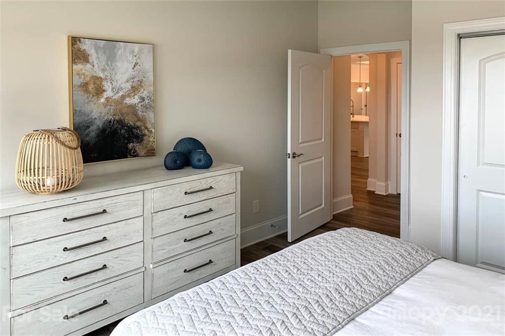 2023 New Style Way, Unit 24 Tega Cay, SC 29708 - Photo 6 of 18 a bedroom with a bed and a dresser