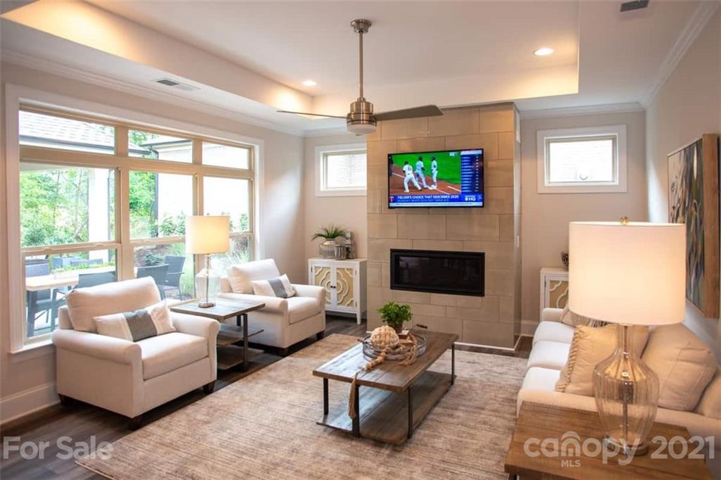 2023 New Style Way, Unit 24 Tega Cay, SC 29708 - Photo 10 of 18 a living room with furniture fireplace and a large window