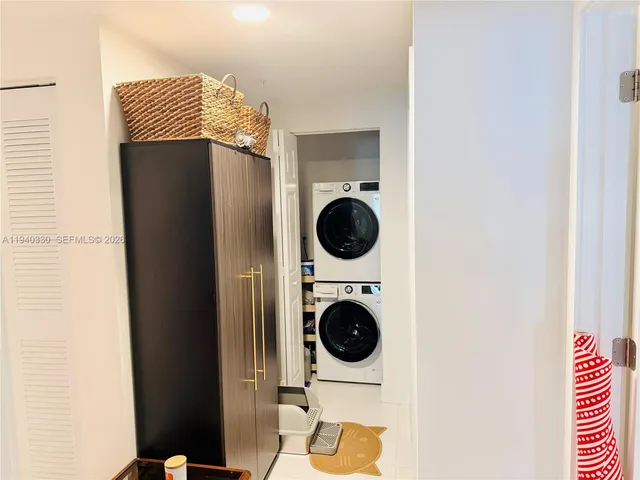 a close view of a utility room with dryer and washer