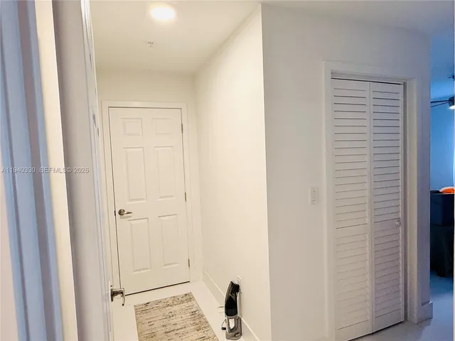 a view of a bedroom from the hallway