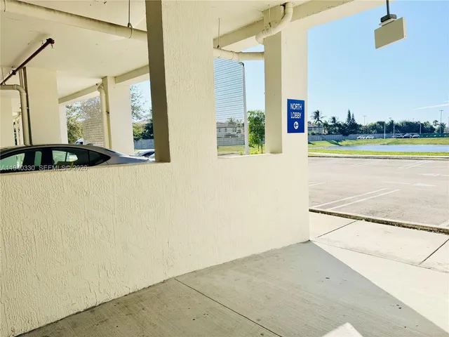 a view of a balcony hardwood floor and an empty room