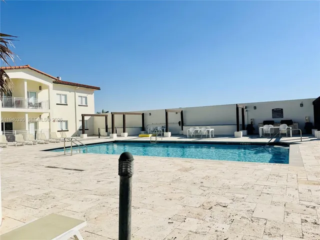 a view of a kitchen with a sink and cabinets