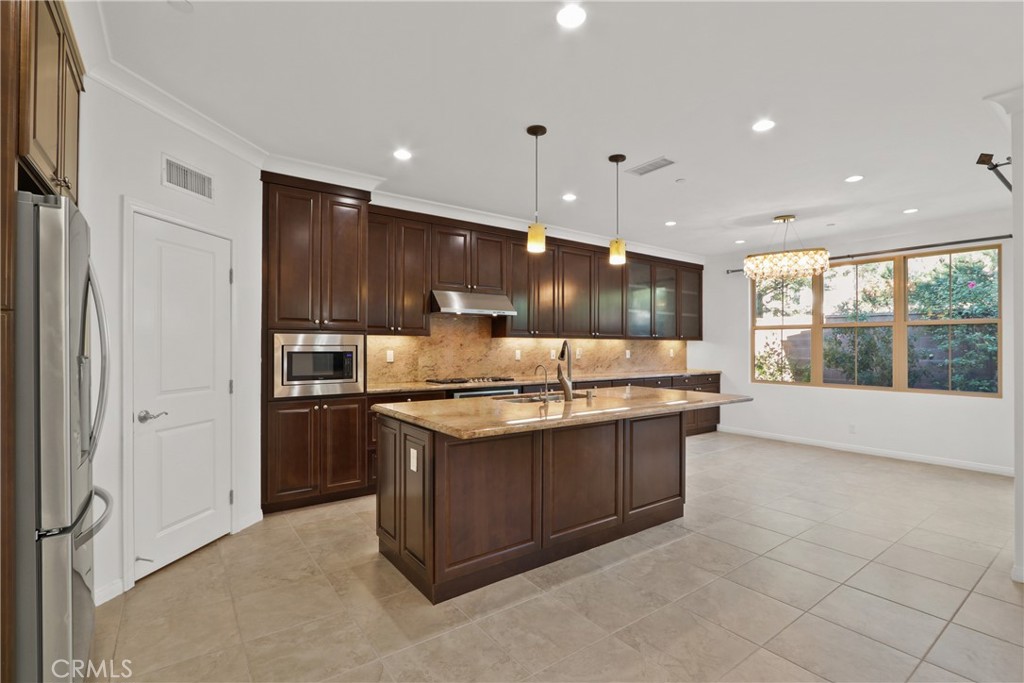 123 Windham Irvine, CA 92620 - Photo 3 of 20 a large kitchen with stainless steel appliances a large counter top