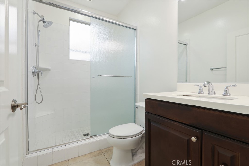 123 Windham Irvine, CA 92620 - Photo 10 of 20 a bathroom with a sink a toilet and shower